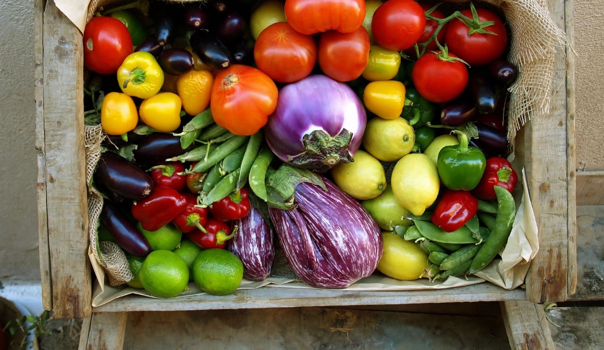 A wooden crate of mixed Sussex vegetables.